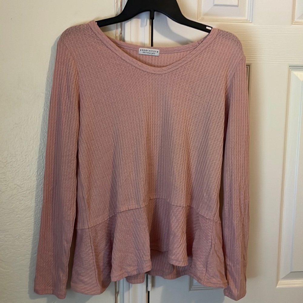 Light pink long sleeve peplum top. Size M